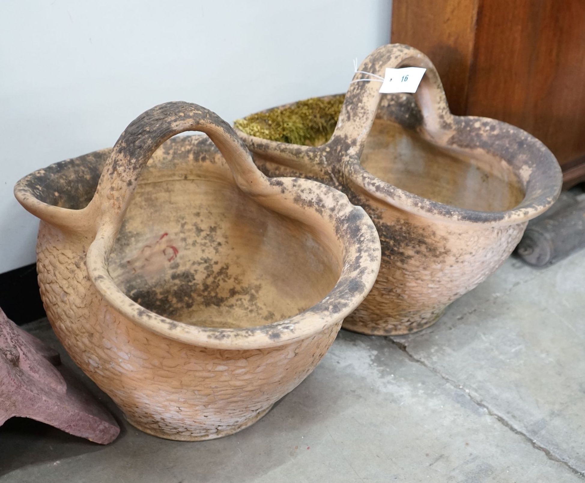 A pair of French terracotta basket garden planters, width 34cm, length 52cm, height 42cm